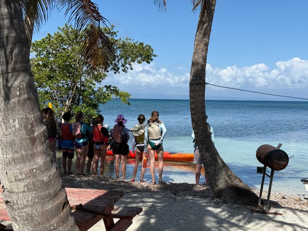 Group gathering at Hawk Caye Lodge